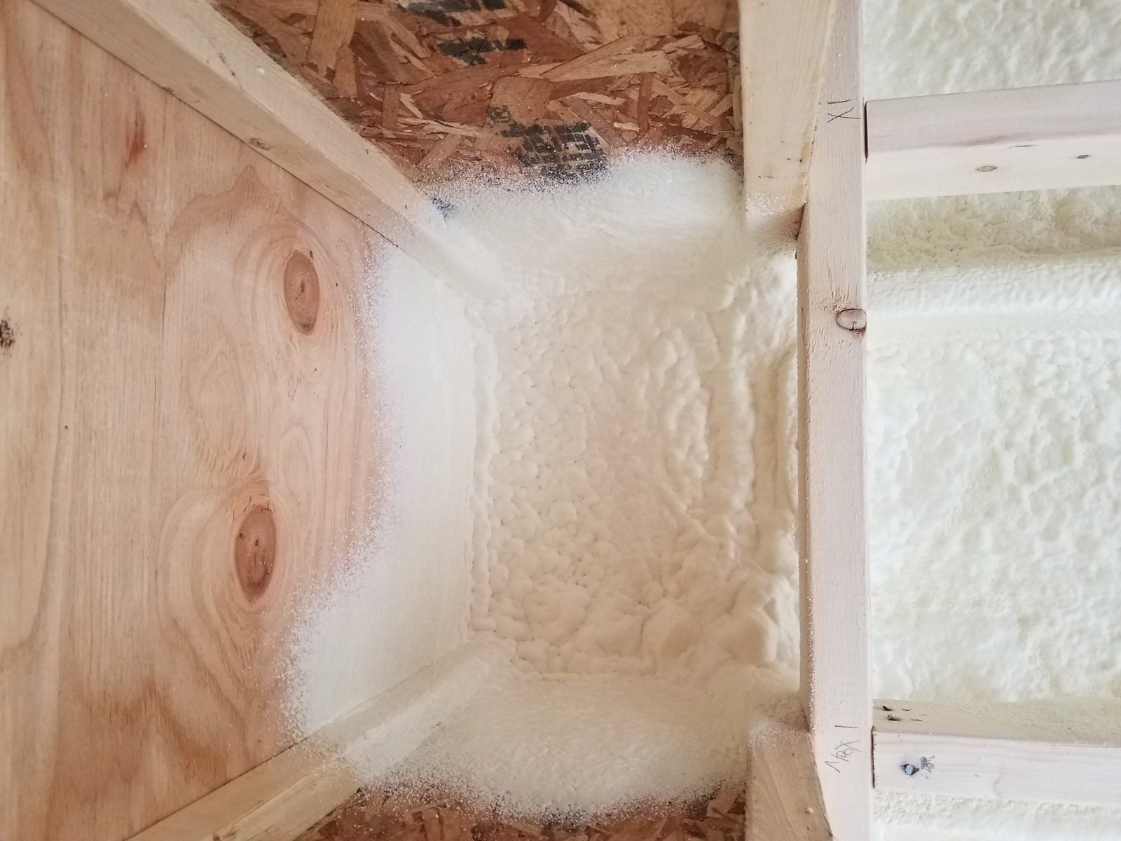 Spray polyurethane foam application in progress