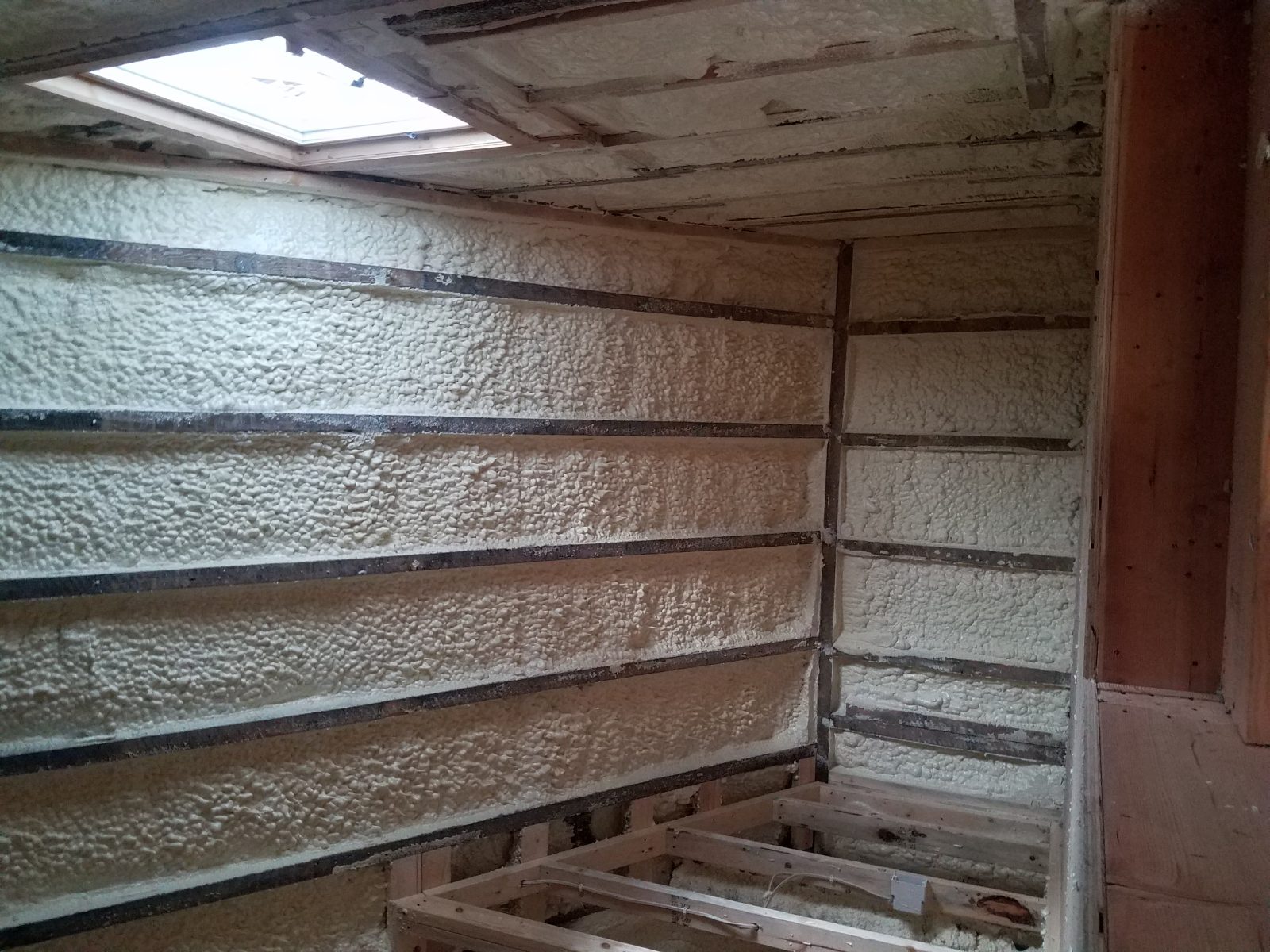 Closed-cell foam sprayed in a metal building